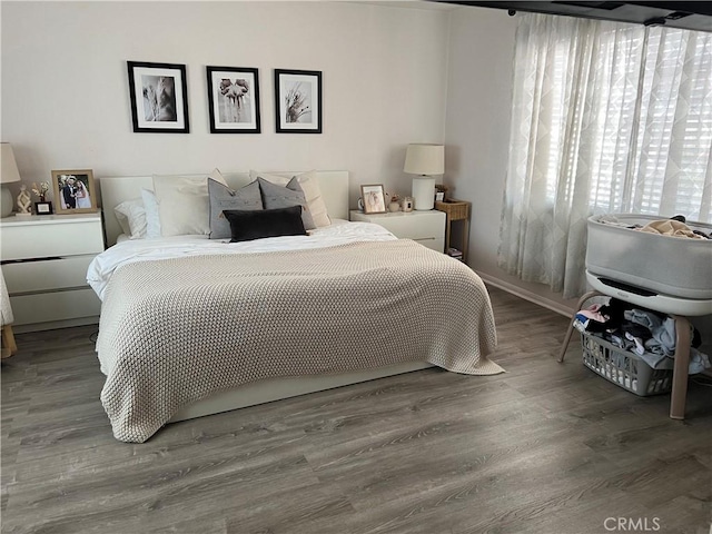 bedroom with wood finished floors