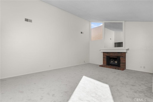 46 Los Palos Dr, San Luis Obispo, CA 93401 - unfurnished living room with carpet floors, a brick fireplace, and baseboards