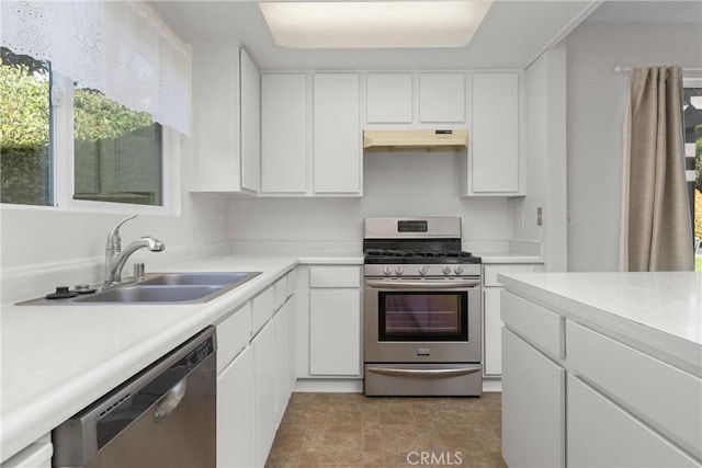 46 Los Palos Dr, San Luis Obispo, CA 93401 - kitchen with stainless steel appliances, under cabinet range hood, a sink, light countertops, and white cabinets