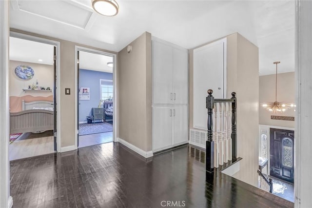 1850 W 186th St, Torrance, CA 90504 - corridor featuring dark wood-type flooring, baseboards, and an upstairs landing