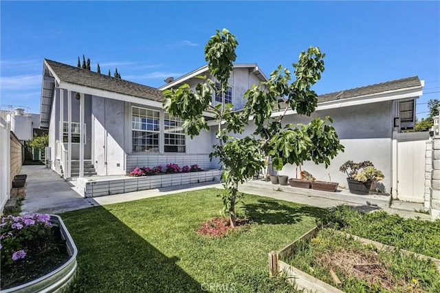 1850 W 186th St, Torrance, CA 90504 - rear view of property with a vegetable garden and stucco siding