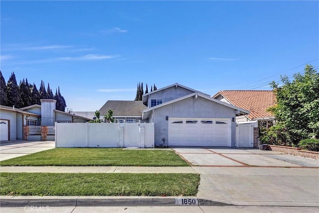 1850 W 186th St, Torrance, CA 90504 - view of front of house with a garage, stucco siding, driveway, and a gate