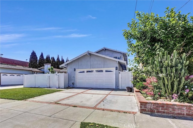 1850 W 186th St, Torrance, CA 90504 - view of front facade with a garage, driveway, and stucco siding