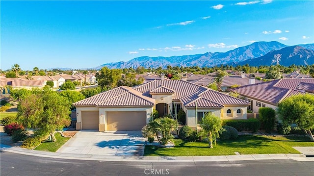 80465 Paseo De Tiempo, Indio, CA 92201 - mediterranean / spanish-style house featuring a garage, stucco siding, a tile roof, and a residential view