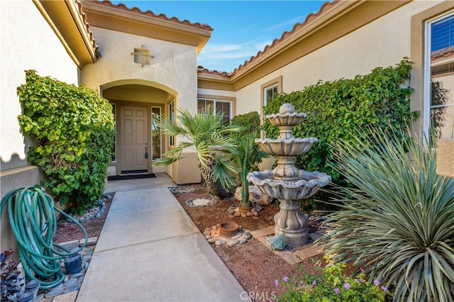 80465 Paseo De Tiempo, Indio, CA 92201 - doorway to property featuring a tile roof and stucco siding