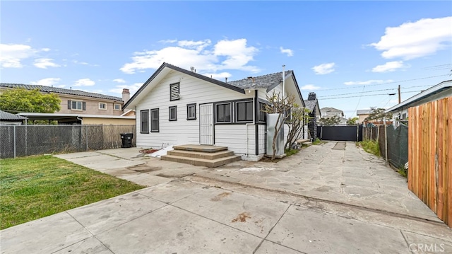 rear view of property with a patio area