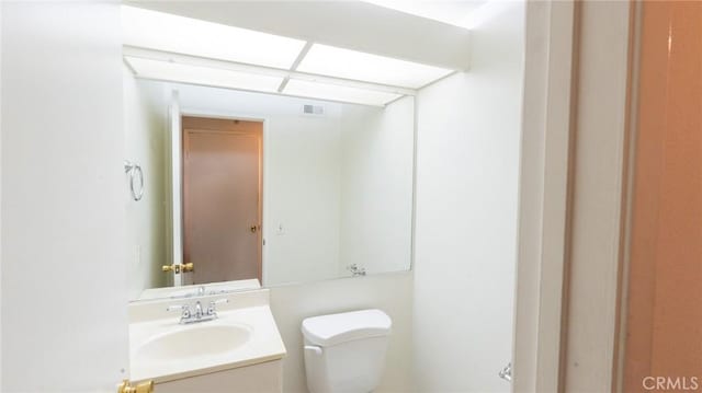 half bath with toilet and vanity
