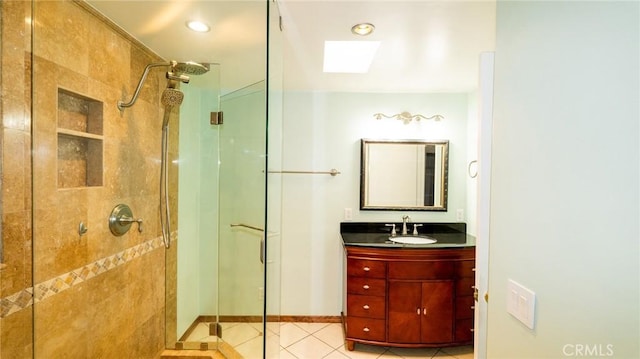 full bathroom with a stall shower, tile patterned flooring, vanity, baseboards, and recessed lighting