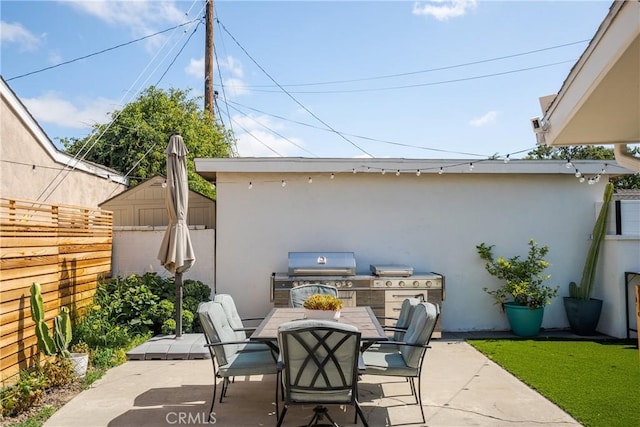 2090 Tevis Ave, Long Beach, CA 90815 - view of patio / terrace with outdoor dining space, a fenced backyard, area for grilling, a grill, and a storage shed