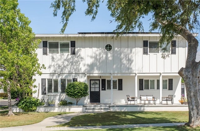 2090 Tevis Ave, Long Beach, CA 90815 - rear view of house with a yard and covered porch