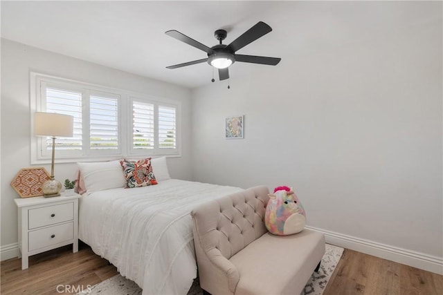 2090 Tevis Ave, Long Beach, CA 90815 - bedroom with light wood finished floors, baseboards, and a ceiling fan