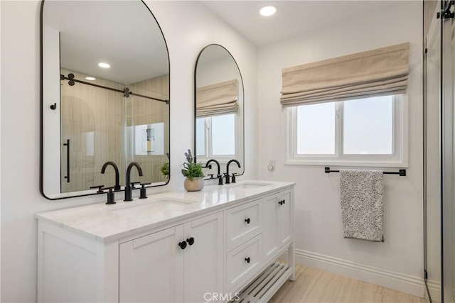 2090 Tevis Ave, Long Beach, CA 90815 - bathroom featuring a stall shower, recessed lighting, double vanity, and baseboards