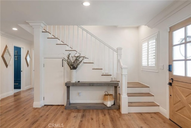 2090 Tevis Ave, Long Beach, CA 90815 - foyer with stairs, light wood-style floors, baseboards, recessed lighting, and crown molding