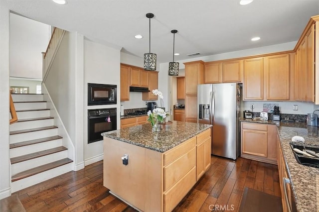 29316 Las Brisas Rd, Valencia, CA 91354 - kitchen featuring black appliances, a center island, dark wood finished floors, recessed lighting, and dark stone countertops