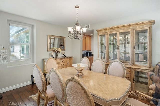 29316 Las Brisas Rd, Valencia, CA 91354 - dining space featuring a chandelier, dark wood-style flooring, and baseboards