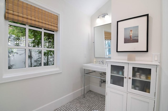 4001 Coldwater Canyon Ave, Studio City, CA 91604 - bathroom with baseboards, vaulted ceiling, and tile patterned floors