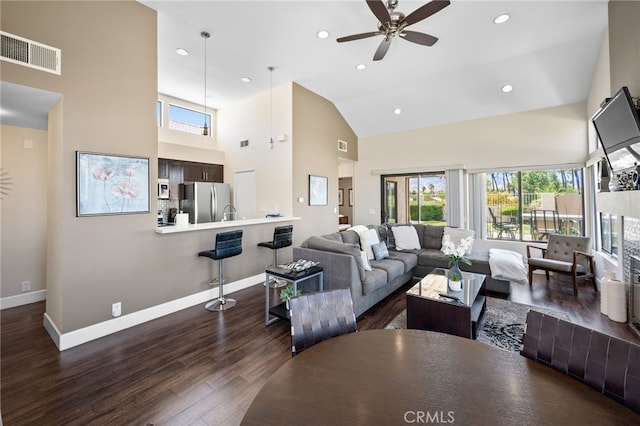living room with high vaulted ceiling, dark wood-style floors, baseboards, recessed lighting, and a ceiling fan