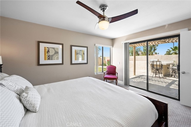 bedroom featuring access to outside, carpet flooring, and ceiling fan