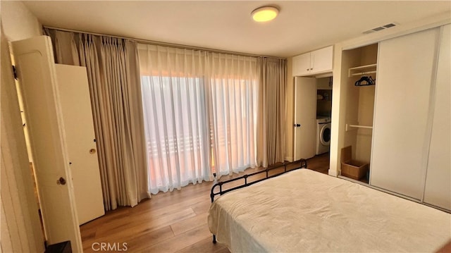 7140 N Muscatel Ave, San Gabriel, CA 91775 - bedroom with washer / dryer, light wood finished floors, and a closet