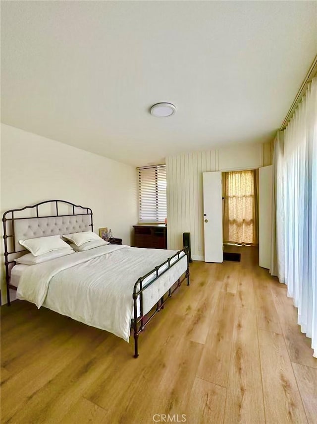 7140 N Muscatel Ave, San Gabriel, CA 91775 - bedroom with multiple windows and light wood-style flooring
