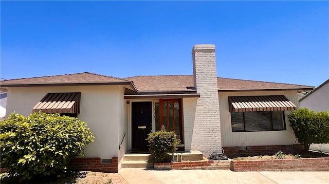 7140 N Muscatel Ave, San Gabriel, CA 91775 - view of front facade featuring crawl space, a shingled roof, and a chimney