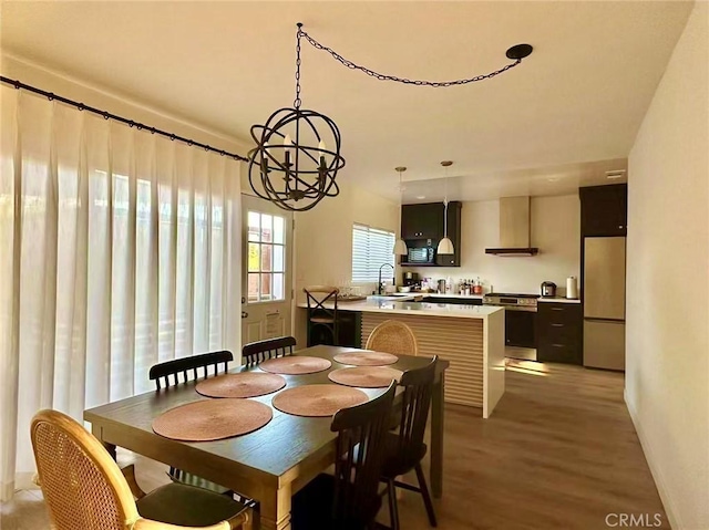7140 N Muscatel Ave, San Gabriel, CA 91775 - dining space featuring a chandelier and light wood-style flooring