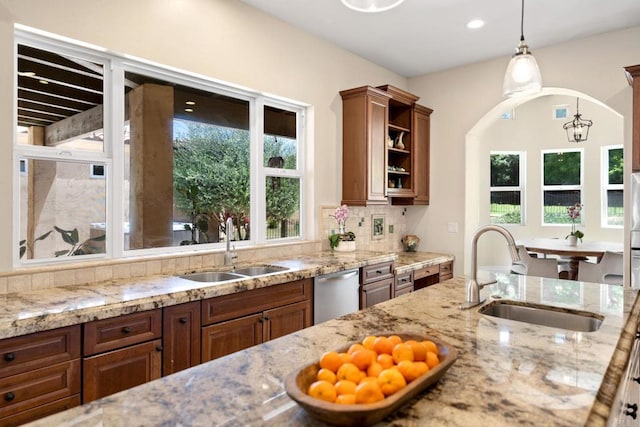 1455 Independence Way, Vista, CA 92084 - kitchen with a sink, light stone counters, brown cabinetry, and recessed lighting