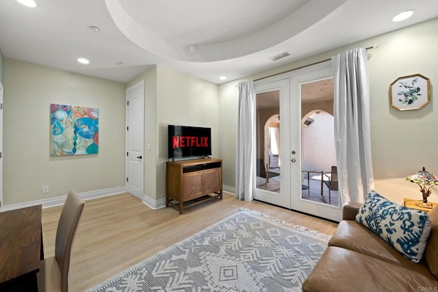 1455 Independence Way, Vista, CA 92084 - living area featuring french doors, light wood finished floors, recessed lighting, and baseboards