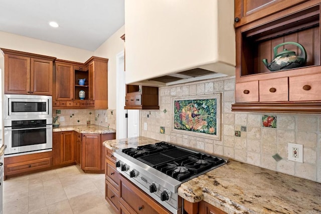 1455 Independence Way, Vista, CA 92084 - kitchen with appliances with stainless steel finishes, premium range hood, open shelves, brown cabinetry, and light stone counters