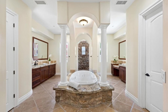 1455 Independence Way, Vista, CA 92084 - bathroom with ornate columns, a garden tub, two vanities, and baseboards