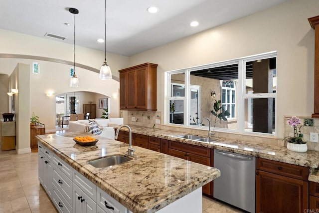 1455 Independence Way, Vista, CA 92084 - kitchen with stainless steel dishwasher, a sink, arched walkways, decorative backsplash, and recessed lighting