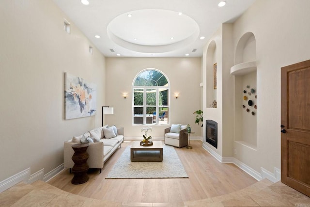 1455 Independence Way, Vista, CA 92084 - living room with recessed lighting, built in features, a glass covered fireplace, heating unit, and light wood finished floors