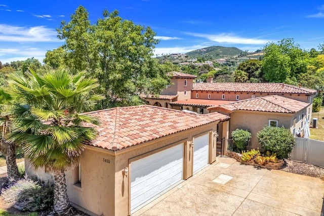 1455 Independence Way, Vista, CA 92084 - garage with a mountain view and concrete driveway