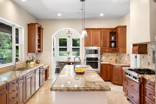 1455 Independence Way, Vista, CA 92084 - kitchen with appliances with stainless steel finishes, a sink, open shelves, arched walkways, and recessed lighting