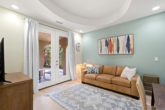 1455 Independence Way, Vista, CA 92084 - living area featuring french doors, wood finished floors, and recessed lighting
