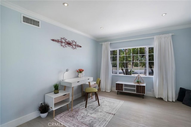 office area featuring baseboards, ornamental molding, recessed lighting, and wood finished floors