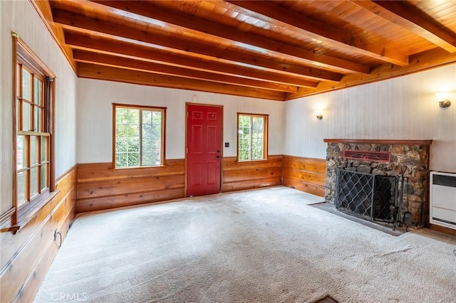 26370 Alpine Ln, Twin Peaks, CA 92391 - unfurnished living room featuring plenty of natural light, wooden walls, a fireplace, beamed ceiling, and wood ceiling