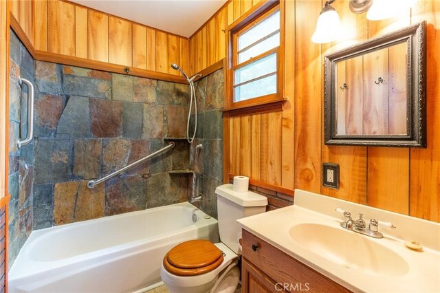 26370 Alpine Ln, Twin Peaks, CA 92391 - bathroom featuring toilet, washtub / shower combination, wood walls, and vanity