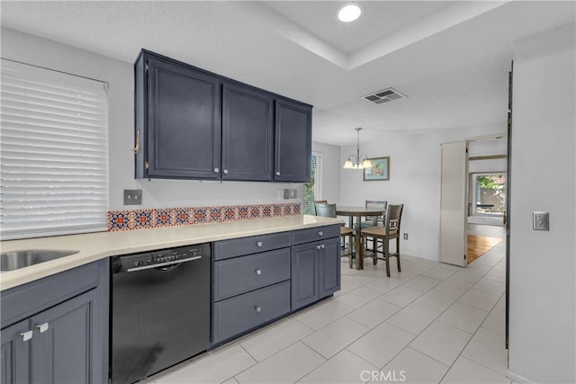 kitchen with black dishwasher, light countertops, healthy amount of natural light, a chandelier, and recessed lighting