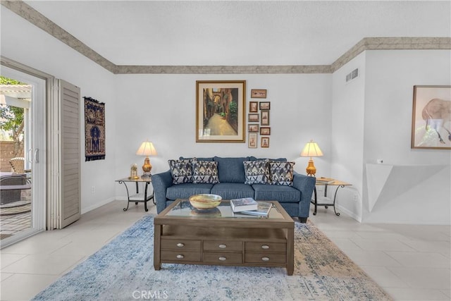 tiled living area featuring baseboards