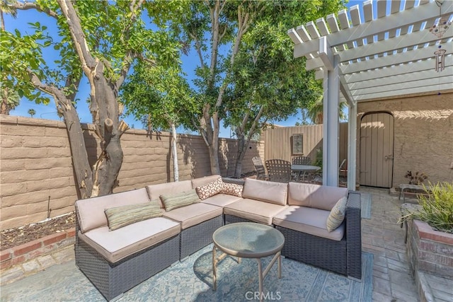 view of patio / terrace with an outdoor hangout area, a fenced backyard, and a pergola