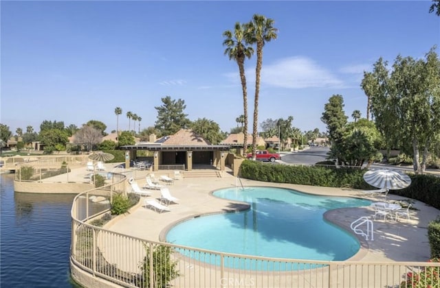 community pool with a patio area