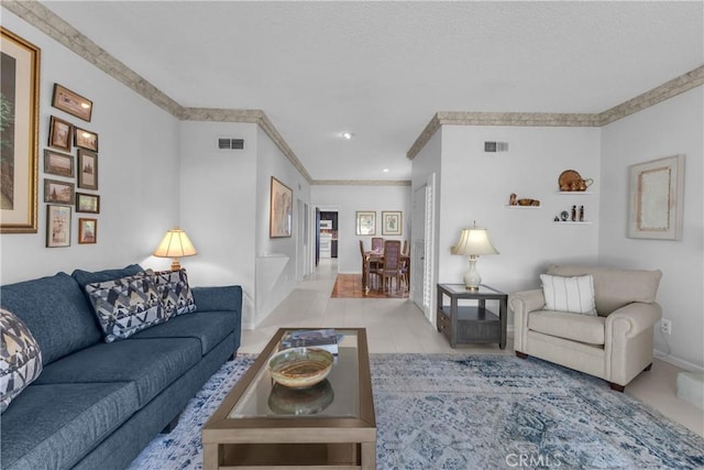 living room featuring crown molding and baseboards