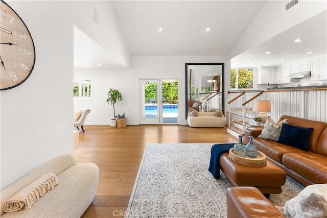 23721 Sarda Rd, Valencia, CA 91355 - living area featuring healthy amount of natural light, light wood-style flooring, high vaulted ceiling, and recessed lighting
