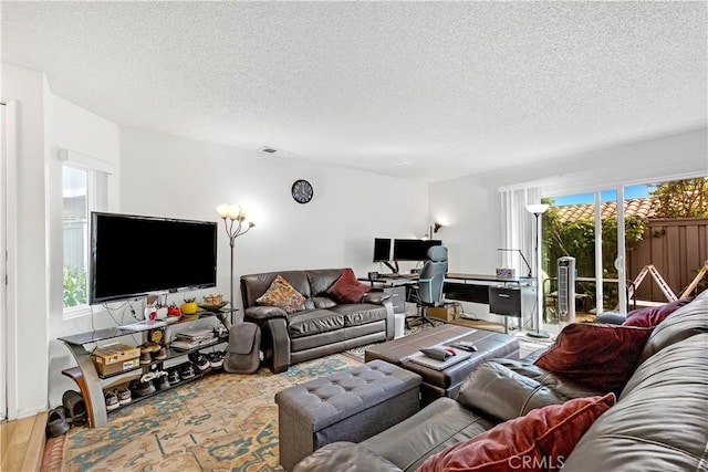 268 Lemon, Irvine, CA 92618 - living area featuring a textured ceiling, a desk, and wood finished floors