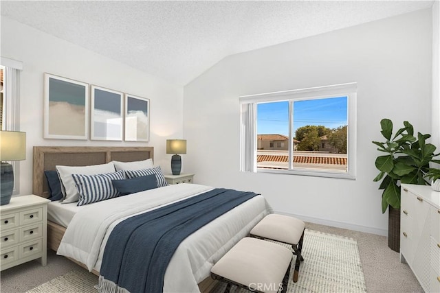 268 Lemon, Irvine, CA 92618 - bedroom featuring lofted ceiling, light colored carpet, baseboards, and a textured ceiling