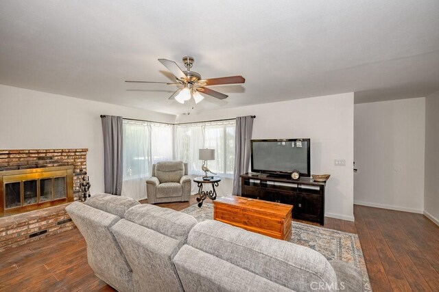 40022 172nd St E, Palmdale, CA 93591 - living area with ceiling fan, wood-type flooring, baseboards, and a fireplace