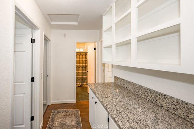 40022 172nd St E, Palmdale, CA 93591 - bar featuring dark wood-type flooring and baseboards