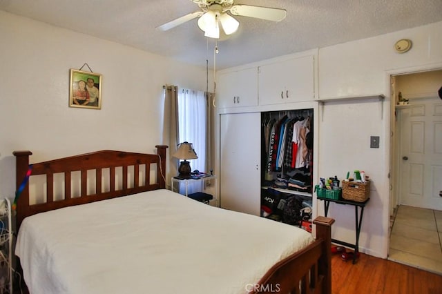 2851 Webster Ave, Long Beach, CA 90810 - bedroom with wood finished floors, a closet, and a ceiling fan