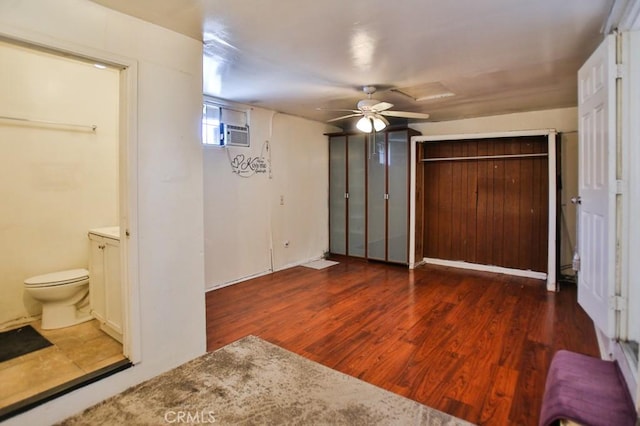 2851 Webster Ave, Long Beach, CA 90810 - unfurnished bedroom featuring wood finished floors, connected bathroom, and ceiling fan